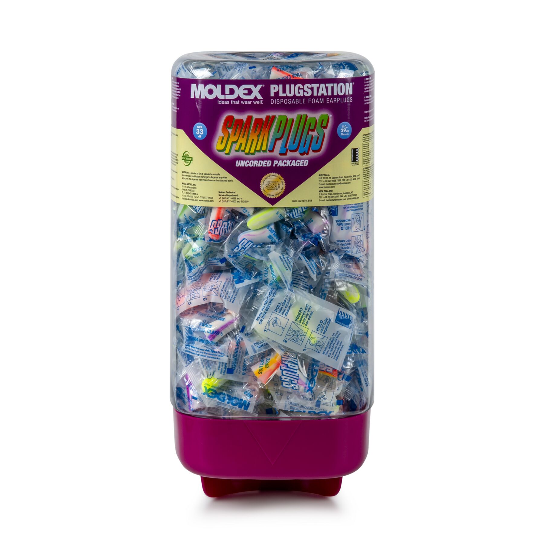 Transparent candy dispenser filled with assorted individually wrapped candies, pink base and purple label reading 'Spark Plugs'.
